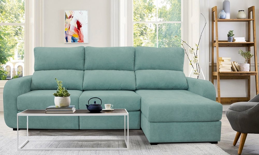 La chaise longue APRIL, tapizada en tela color verde, convertible en cama y con arcón de almacenaje hygge decoracion